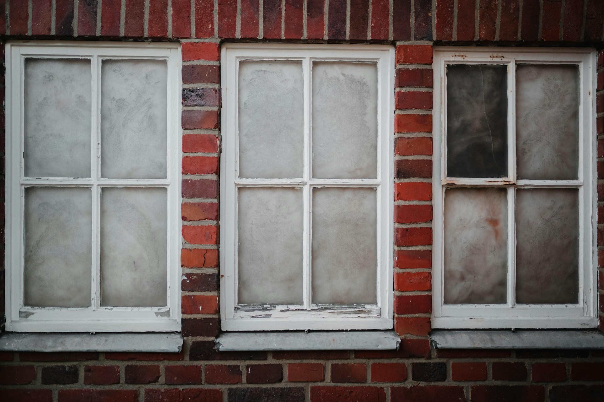 Timber window frame showing signs of rot and deterioration due to moisture ingress